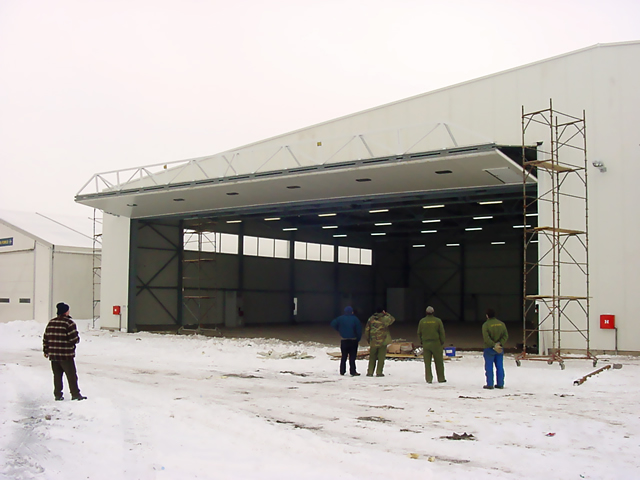 Large bifold door on aircraft hangar in Europe