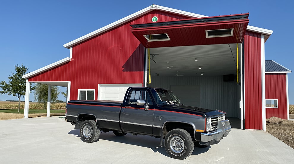 Schweiss bifold farm shop door installed on Beranek automotive farm shop in Minnesota Schweiss bifold farm shop door installed on Beranek automotive farm shop in Minnesota