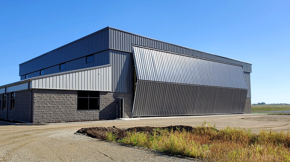 Schweiss bifold hangar door installed on Cloudkisser Hangar, which is home to a Citation jet named Cloudkisser II Schweiss bifold hangar door installed on Cloudkisser Hangar, which is home to a Citation jet named Cloudkisser II