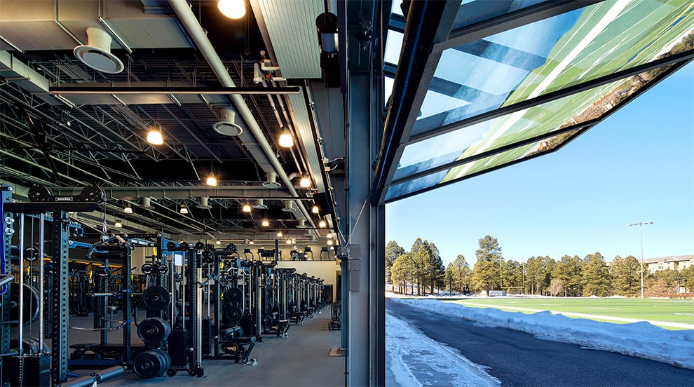 Schweiss glass bifold door installed on Northern Arizona University football performance center Schweiss glass bifold door installed on Northern Arizona University football performance center