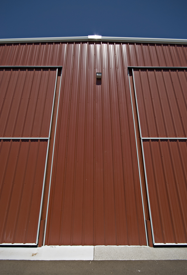 close up of twin bifold doors on steel building