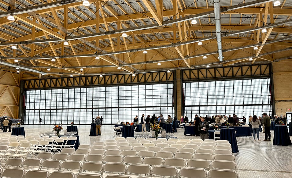 Interior view of an event hosted in hangar fitted with 120ft Schweiss hydraulic door