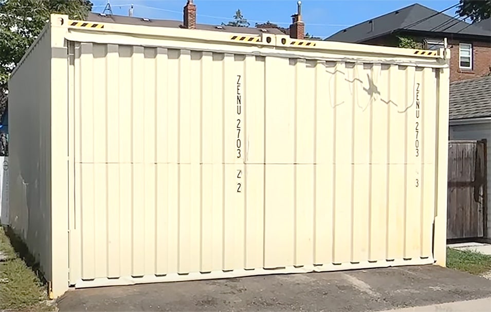 Exterior view of Schweiss container door fitted on container garage shown closed Exterior view of Schweiss container door fitted on container garage shown closed