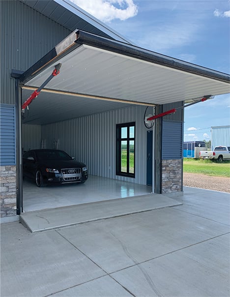 Exterior view of second Schweiss hydraulic door fitted on Econo Lumber hangar shown open