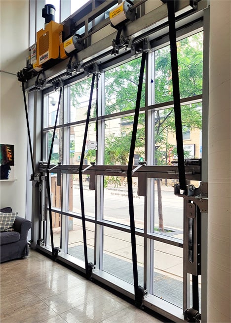 Interior view of Schweiss bifold door fitted on Hard Feelings' new storefront location shown closed