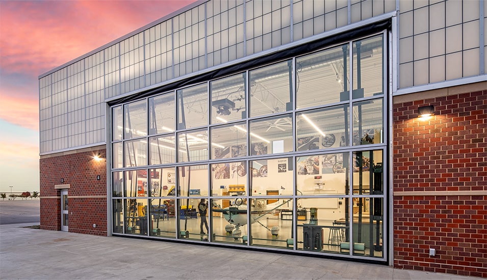 Exterior view from right of Schweiss glass bifold door installed on Lincoln North Star High School shown closed Exterior view from right of Schweiss glass bifold installed on Lincoln North Star High School shown closed