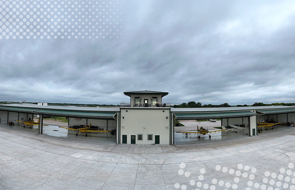 Exterior view from front of Nebraskaland Hangar fitted with multiple Schweiss bifold doors shown open Exterior view from front of Nebraskaland Hangar fitted with multiple Schweiss bifold doors shown open