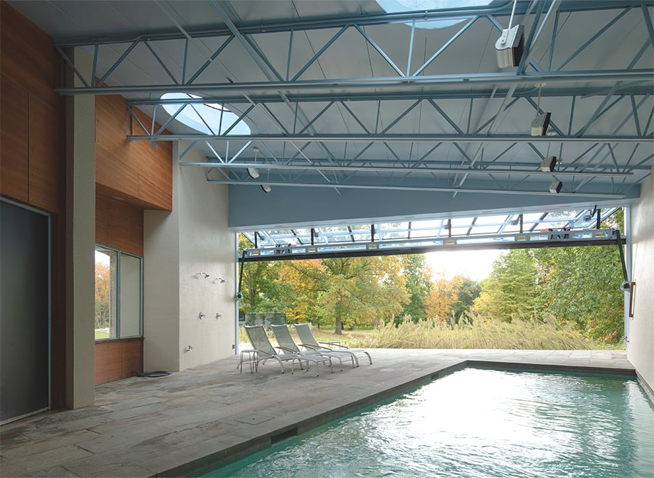 Interior view of NY Pool House showing the Schweiss bifold door while open