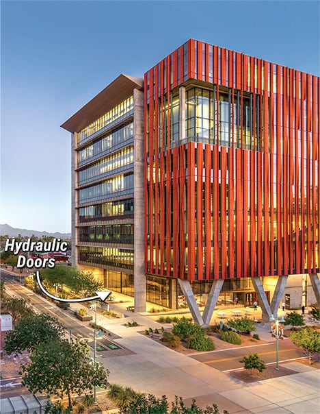Wide shot of the Health Science building at the University of Arizona with an arrow pointing to where the Schweiss hydraulic doors are located