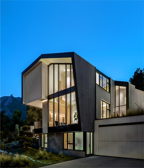 Angled side view of the Vergence House, fitted with a Schweiss bifold door on its garage Angled side view of the Vergence House, fitted with a Schweiss bifold door on its garage