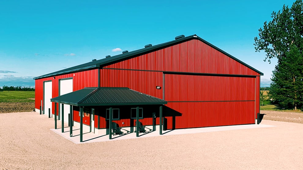 Schweiss bifold agricultural door installed on building at Devitt Farms shown closed Schweiss bifold agricultural door installed on building at Devitt Farms shown closed
