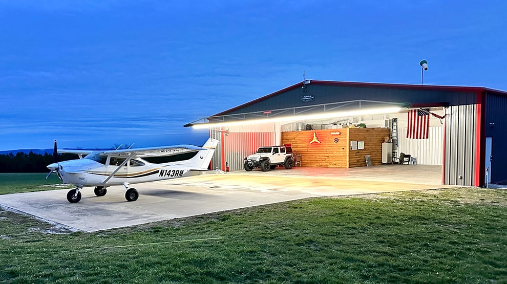 Schweiss hydraulic hangar door that has been customized by adding a light to it mounted on a hangar Schweiss hydraulic hangar door that has been customized by adding a light to it mounted on a hangar