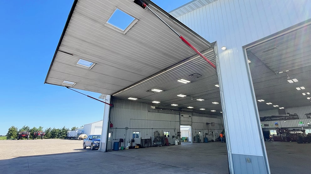 Exterior righthand view of a Schweiss hydraulic machine shed door shown open Exterior righthand view of a Schweiss hydraulic machine shed door shown open