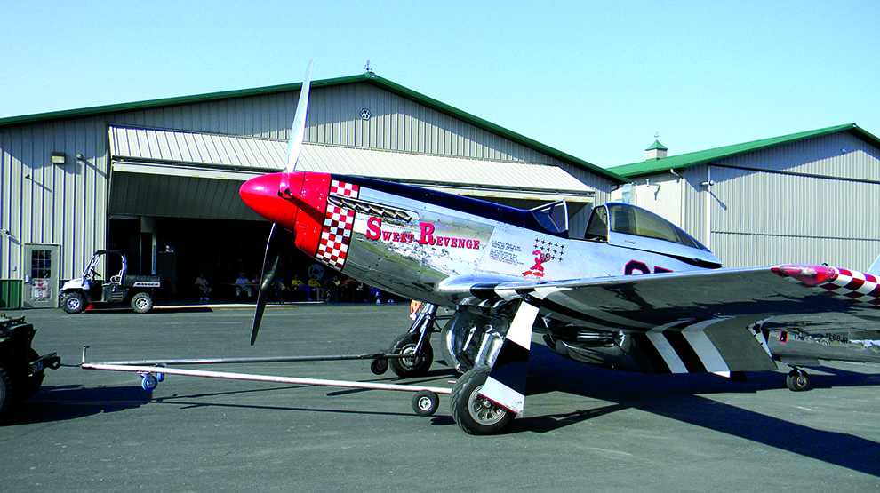 P51 Mustang being shown at Fagen WWII museum in front of hangar that utilizes a Schweiss bifold door P51 Mustang being shown at Fagen WWII museum in front of hangar that utilizes a Schweiss bifold door