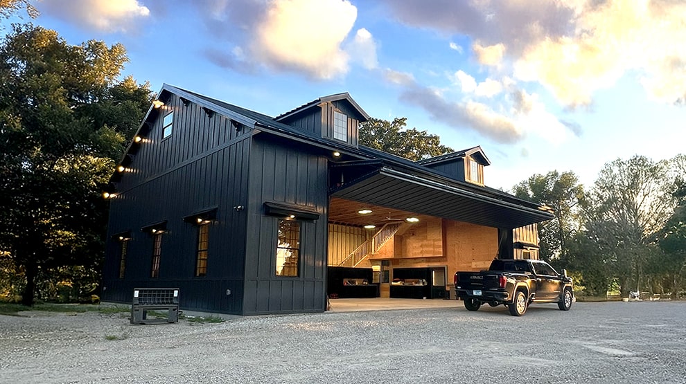 Schweiss lift strap bifold hangar door installed on Goat Farm shed door shown open Schweiss lift strap bifold hangar door installed on Goat Farm shed door shown open