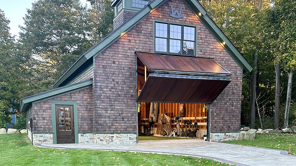 Schweiss bifold boathouse door with beautiful wood cladding fitted on boat storage shed owned by Greg Webb Schweiss bifold boathouse door with beautiful wood cladding fitted on boat storage shed owned by Greg Webb