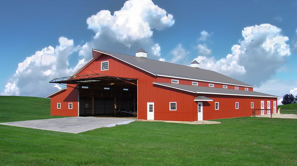 Schweiss hydraulic machine shed door installed onto barn-like ag-building shown in the open position Schweiss hydraulic machine shed door installed onto barn-like ag-building shown in the open position