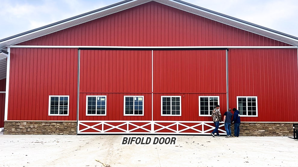 Schweiss bifold door fitted on barn-like building Schweiss bifold door fitted on barn-like building
