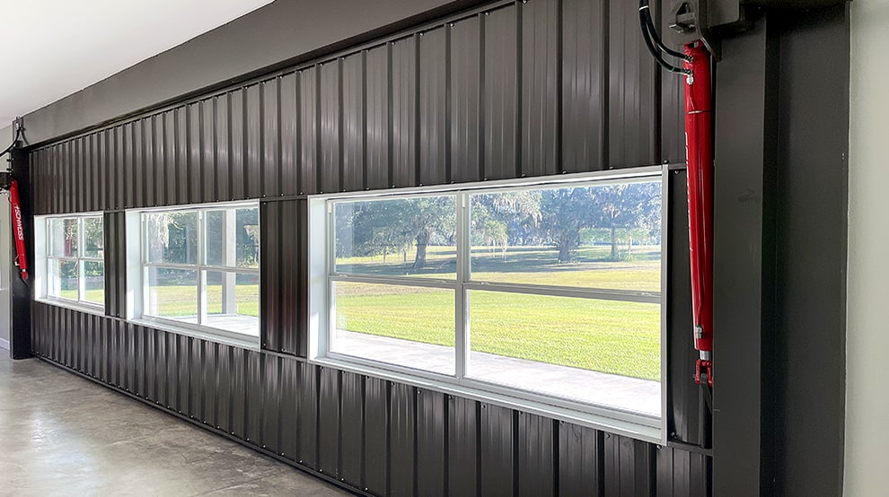 Interior view of Schweiss black hydraulic garage door used on garage shown closed Interior view of Schweiss black hydraulic garage door used on garage shown closed