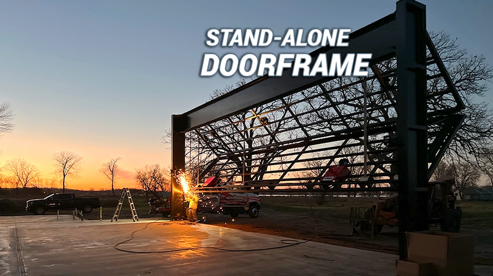 Schweiss stand alone bifold doorframe demonstrating that it can infact stand without a building Schweiss stand alone bifold doorframe demonstrating that it can infact stand without a building