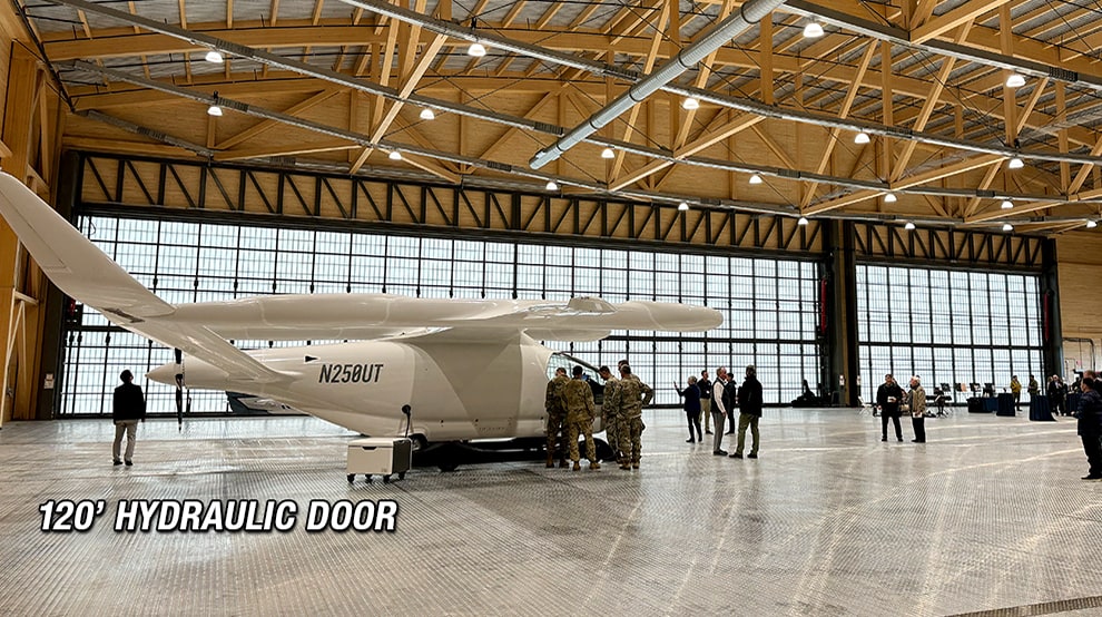 Medium airplane parked inside hangar that has a 120ft Schweiss hydraulic hangar door shown closed Medium airplane parked inside hangar that has a 120ft Schweiss hydraulic hangar door shown closed