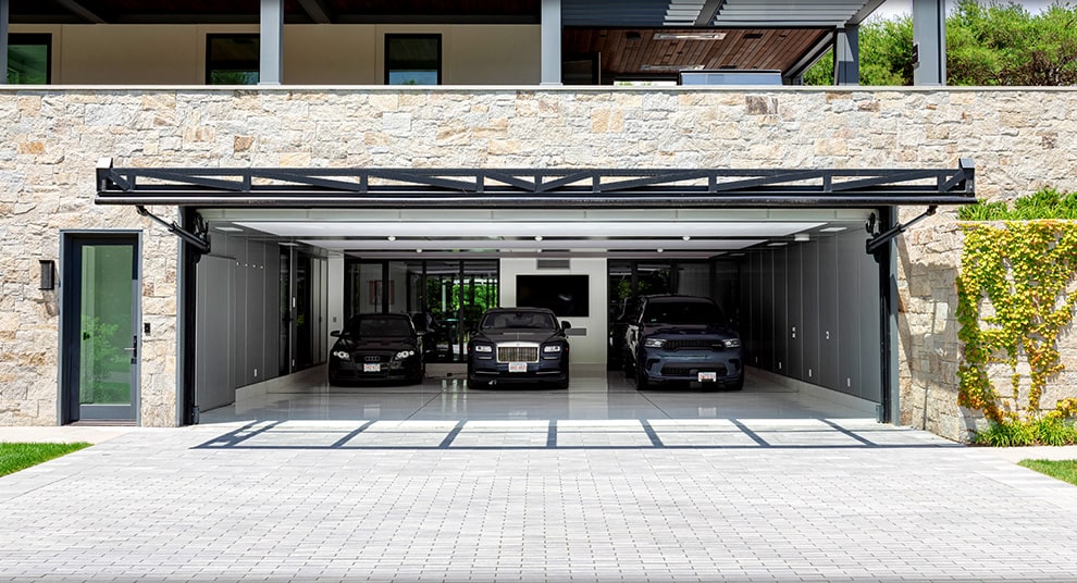 Glass Arizona hydraulic door by Schweiss fitted on luxury garage