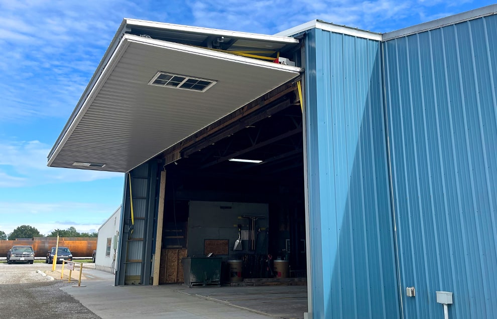 Arizona stand alone bifold door fitted on blue building shown open