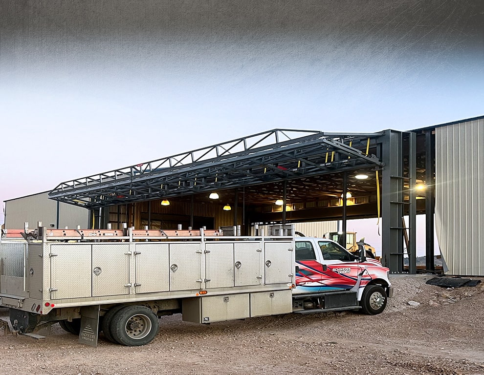 Arkansas bifold frame by Schweiss being installed on a building